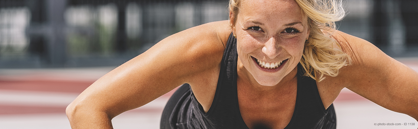 Cross training. Young woman exercising with dumbbells from ©rcfotostock