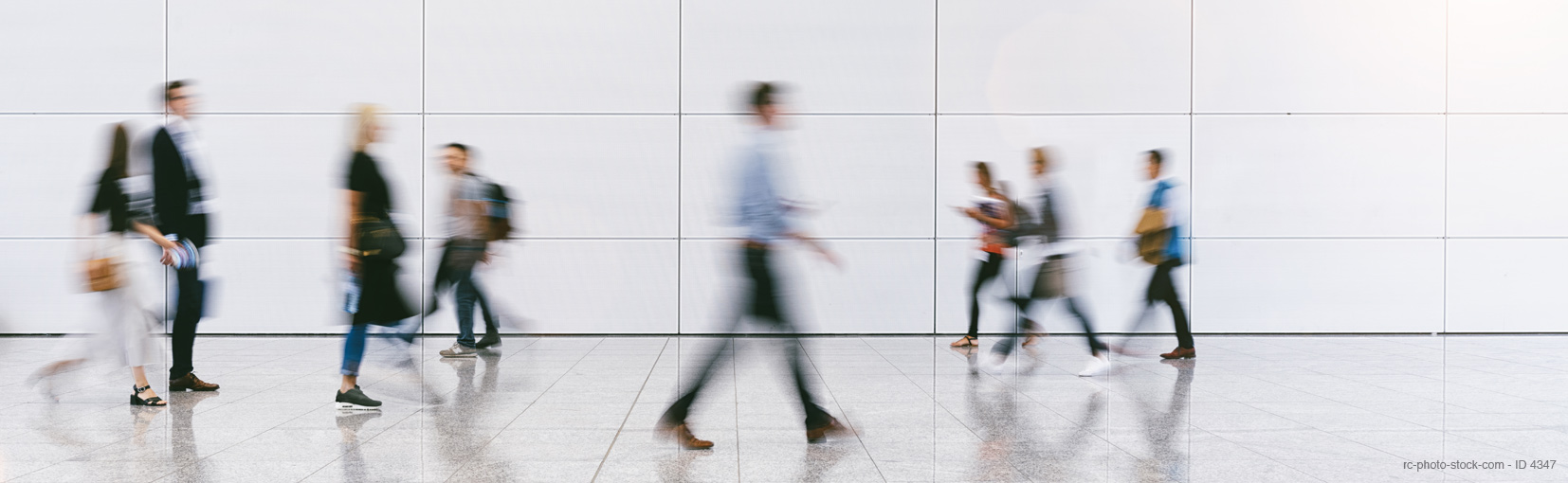 blurred business people at a trade fair messe from ©rcfotostock